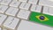 Key with flag of Brazil on the keyboard switches to key with flag of Germany, translation or relocation related