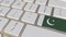 Key with flag of Pakistan on the computer keyboard switches to key with flag of France, translation or relocation