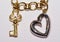 Key and heart jewelry with white background