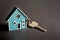 key with house shaped keychain concept for buying a new home, renting. moving, generative ai