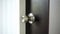 The key is inserted into the keyhole of the door of the house and open.