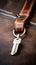 A key on a leather keychain, AI