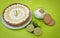 Key Lime Pie with ingredients on a green background