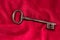 Key on a red velvet cushion