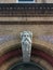 Key stone bust in arched brick doorway