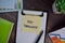 Key Takeaways write on sticky notes isolated on Wooden Table