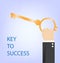 Key to success,hand of businessman with golden key