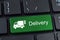 Keyboard button with truck icon and text delivery.