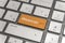 Keyboard with orange key Enter and word Webinar button modern pc