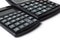 Keyboards of two different calculators close-up in selective focus