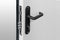 Keyhole and bolts at black white door with black handle