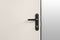 Keyhole and bolts at brown white door with black handle