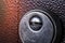 Keyhole close-up on brown door background