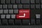 Keypad of black keyboard and have text ISO9001 on enter button.