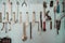 Keys in the garage tools. Old tools hanging on wall in workshop , Tool shelf against a wall  in the garage