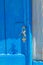 Keys left in the lock of blue door Manolas village Therasia island Cyclades Greece