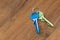 keys on wooden table background. rent sell buy apartment estate business