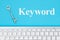 Keyword message with gray keyboard with a vintage skeleton key