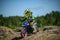 KHABAROVSK, RUSSIA - june 16, 2019 :Racer child on motorcycle participates in motocross cross-country in flight, jumps