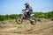 KHABAROVSK, RUSSIA - june 16, 2019 :Racer child on motorcycle participates in motocross cross-country in flight, jumps