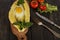 Khachapuri with fresh vegetables caucasian kitchen, close-up on a black wooden table. Adzharian khachapuri. View from above