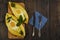 Khachapuri with fresh vegetables caucasian kitchen, close-up on a black wooden table. Adzharian khachapuri. View from above