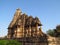 Khajuraho Temple Group of Monuments in India with erotic sculptures on the wall