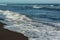 Khalaktyrsky beach with black sand. Pacific Ocean washes Kamchatka Peninsula.