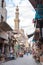 Khan Al-Khalili market street scene with mosque and local vendors cairo Egypt