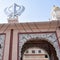 Khanda Sikh holy religious symbol at gurudwara entrance with bright blue sky image is taken at Sis Ganj Sahib Gurudwara in Chandni