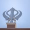 Khanda Sikh holy religious symbol at gurudwara entrance with bright blue sky image is taken at Sis Ganj Sahib Gurudwara in Chandni