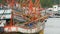 Khanom, Thailand - September 21, 2018. Rusty boats at coast. Old rusty ships parked at port in Fisherman city. Fishing