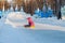 KHANTY-MANSIYSK, RUSSIA-January 23, 2019:Children ride from the ice slide in winter on the street square. Theme outdoor winter ent