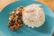 Khao Kraprao Moosub Khai Dow or Thai rice stir-fried minced pork with fried egg