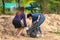 Khao Lak, Thailand, 1 june 2019: Asian women volunteers clean up trash and clean the beach of dirt and waste on