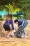 Khao Lak, Thailand, 1 june 2019: Asian women volunteers clean up trash and clean the beach of dirt and waste on international