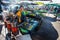 Khao Lak, Thailand - February 22, 2016: Local woman preparing vegetable latkes in her mobile stall in morning market. Thai