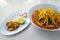 Khao Soi or Northern Thai Curry Noodles with Chicken and Side Dishes Is a street food