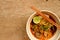 Khaosoi is a thai northern food on the wood background