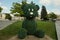 Kharkiv, Ukraine, August 2019 Big teddy bear topiary figure in city park. Outdoor fun decoration from green plant and bushes. Kids