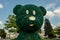 Kharkiv, Ukraine, August 2019 Big teddy bear topiary figure in city park. Outdoor fun decoration from green plant and bushes. Kids