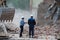 Kharkiv, Ukraine - May 13, 2011: Two builders at the epicenter of the demolition, dismantling of the building