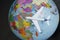 KHARKOV, UKRAINE- 13 APRIL 2018: Airplane on the globe. Travel c