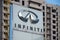 KHARKOV, UKRAINE - AUGUST 5, 2019: Infiniti showroom building exterior with big logo in evening daytime