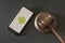 KHARKOV, UKRAINE - JUNE 25, 2020: Smartphone with Android logo on screen and Judge gavel. Legality concept