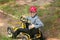 Kharkov, Ukraine - May 9, 2018: A little boy is sitting in a car for children. Recreation. Sport