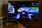 KHARKOV, UKRAINE - NOVEMBER 12, 2020: Video game controller Gamesir g3s on table with Gran Turismo 7 game on display