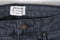 KHARKOV, UKRAINE- OCTOBER 22, 2018: White label DENIM Miss Selfridge on gray jeans. Close up. Fashion concept