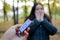 KHARKOV, UKRAINE - OCTOBER 8, 2019: Male hand passes the girl a Snickers chocolate bar in an autumn park. The manifestation of