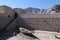 Khasab Castle Wall with Mountains and Boat